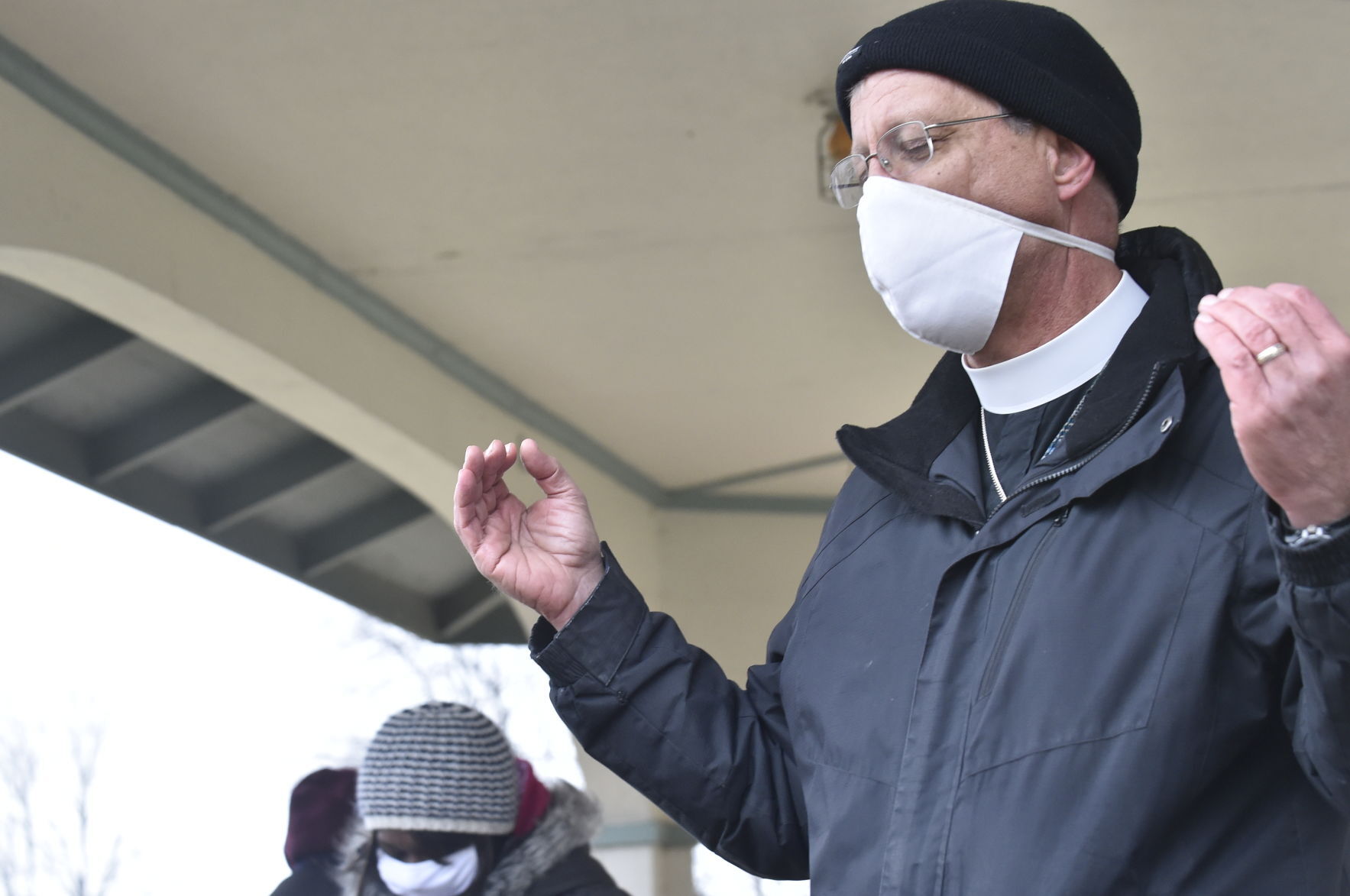 Evangelical Lutheran Church of America Bishop Paul Erickson of Milwaukee leads a prayer and calls for solidarity
